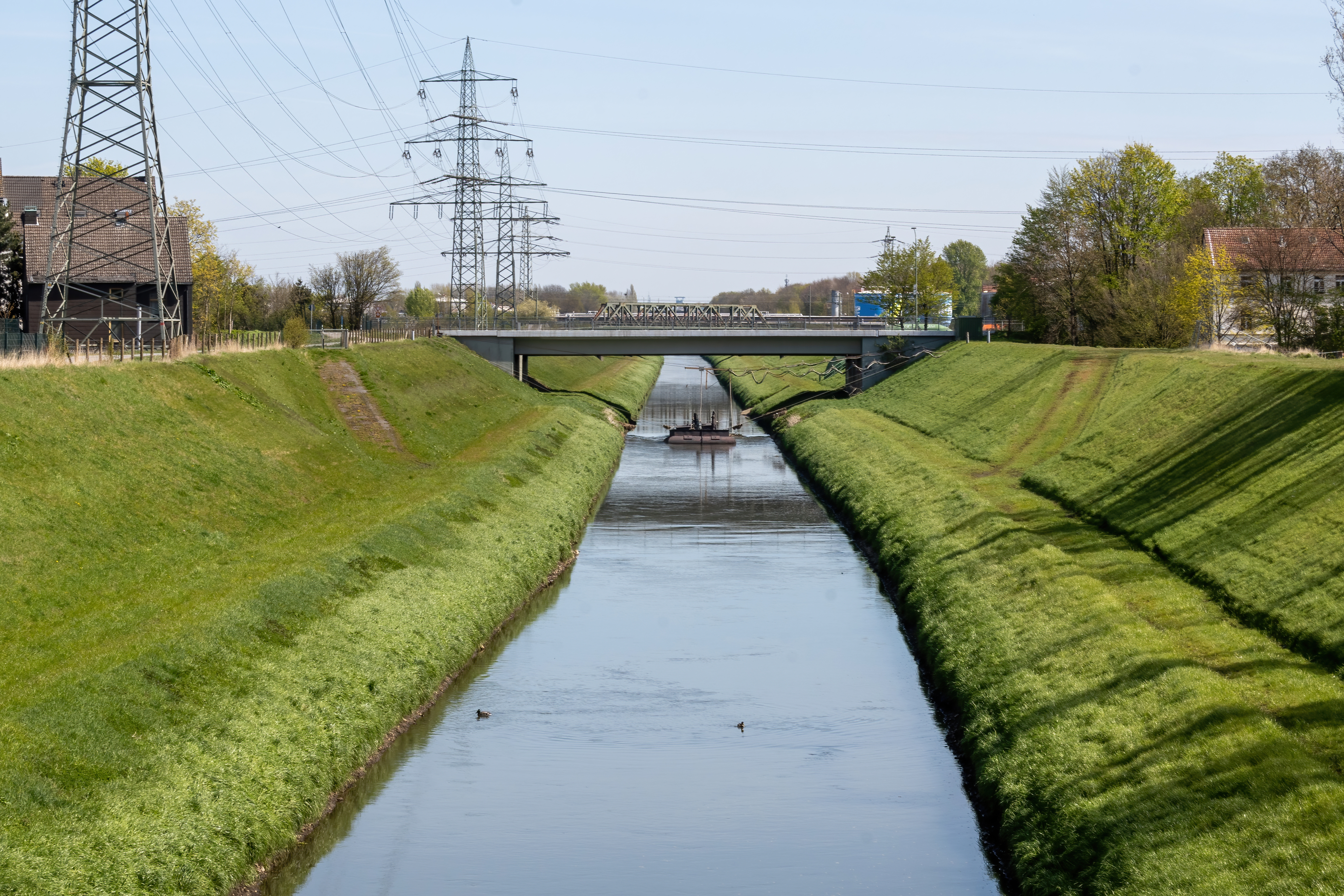 bridge-over-the-canal-in-industrial-area-2023-11-27-05-35-21-utc